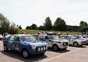 3 rally cars on display at Gaydon